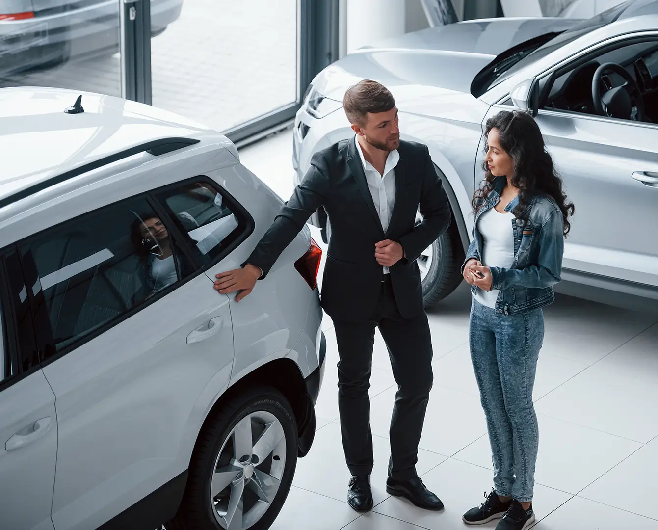 Customer viewing a vehicle at a dealership